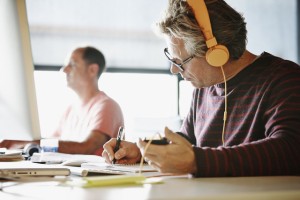 open-offices-worker-with-headphones